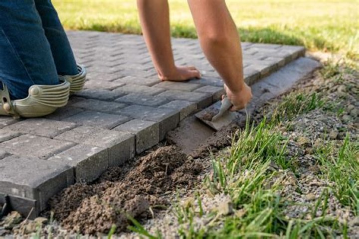 How do you install brick edging on a lawn