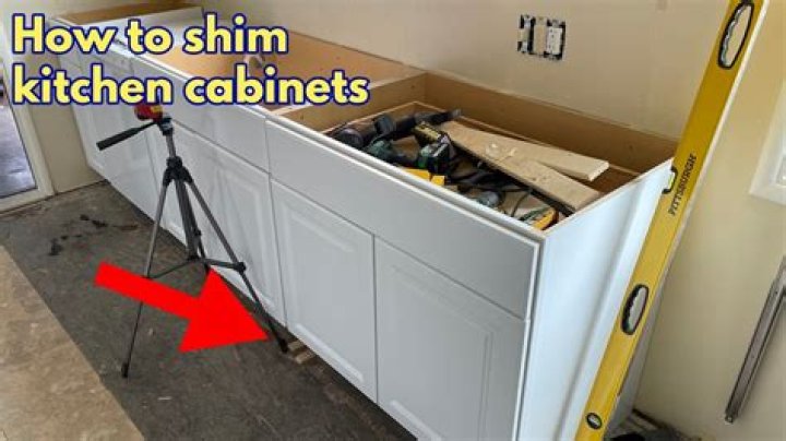 How do you shim lower cabinets